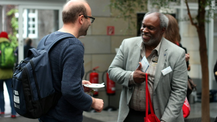 two people talking in foyer